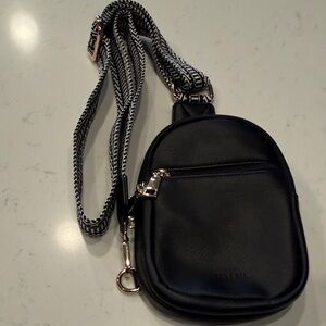 Elegant Black Mini Backpack with Patterned Strap